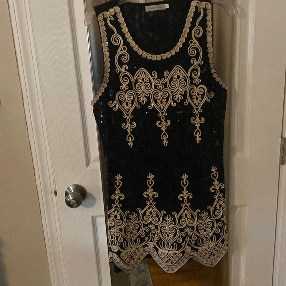Beautiful shimmery gold embroidered tank dress. Back is sheer. Fits like a M-L